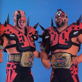 Two butch men wearing silly spiked shoulder pads